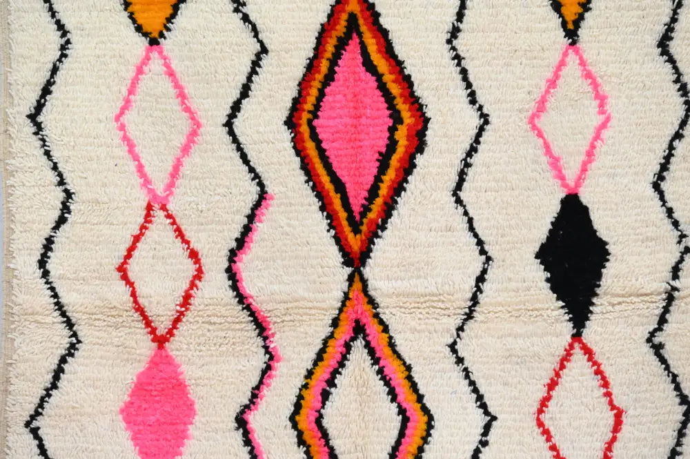 Handmade beige azilal rug with geometric patterns bedroom decor
