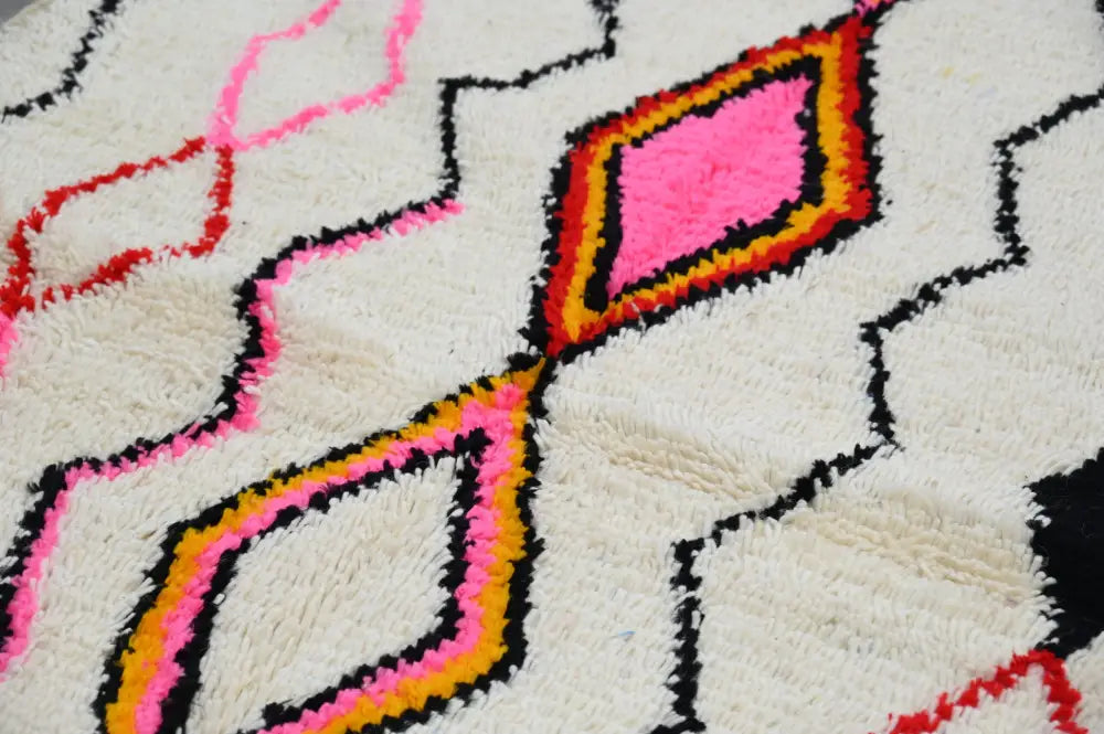 Handmade beige azilal rug with geometric patterns bedroom decor