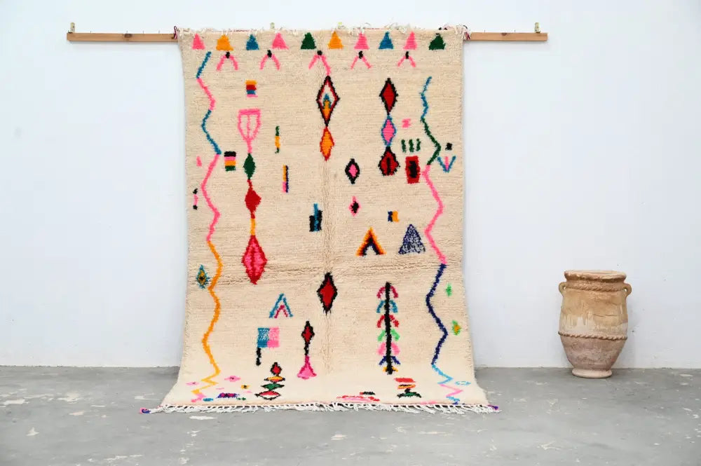 Handmade beige moroccan azilal rug with colorful patterns living room