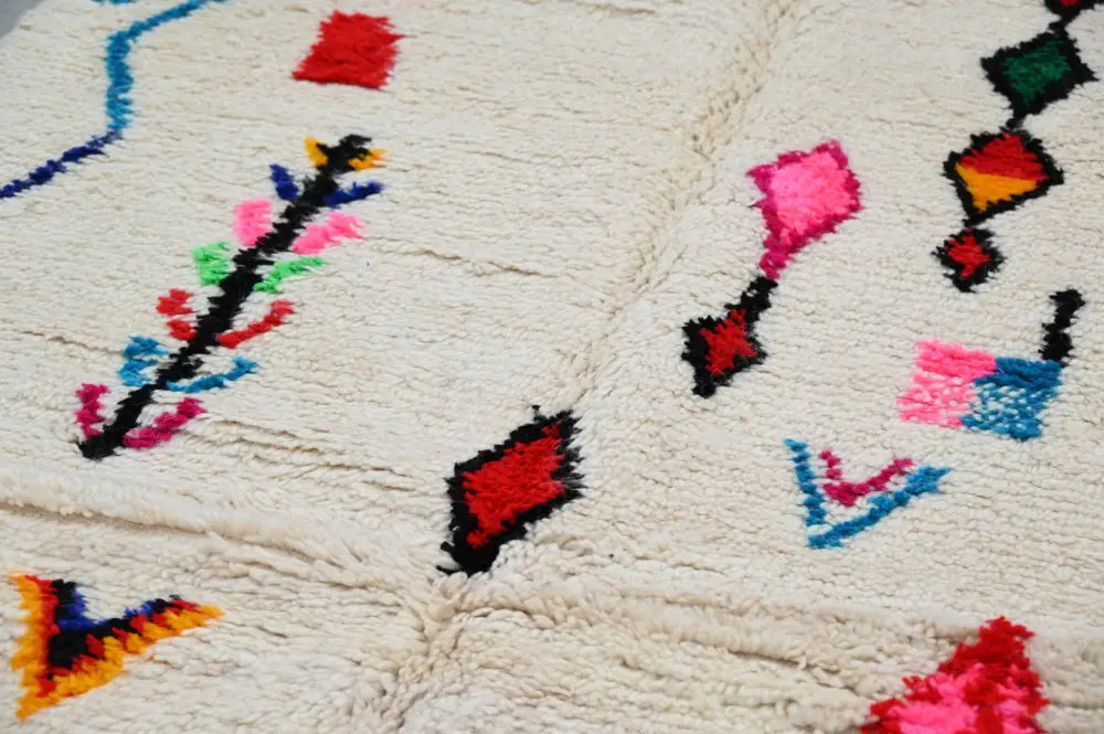 Handmade beige moroccan azilal rug with colorful patterns living room