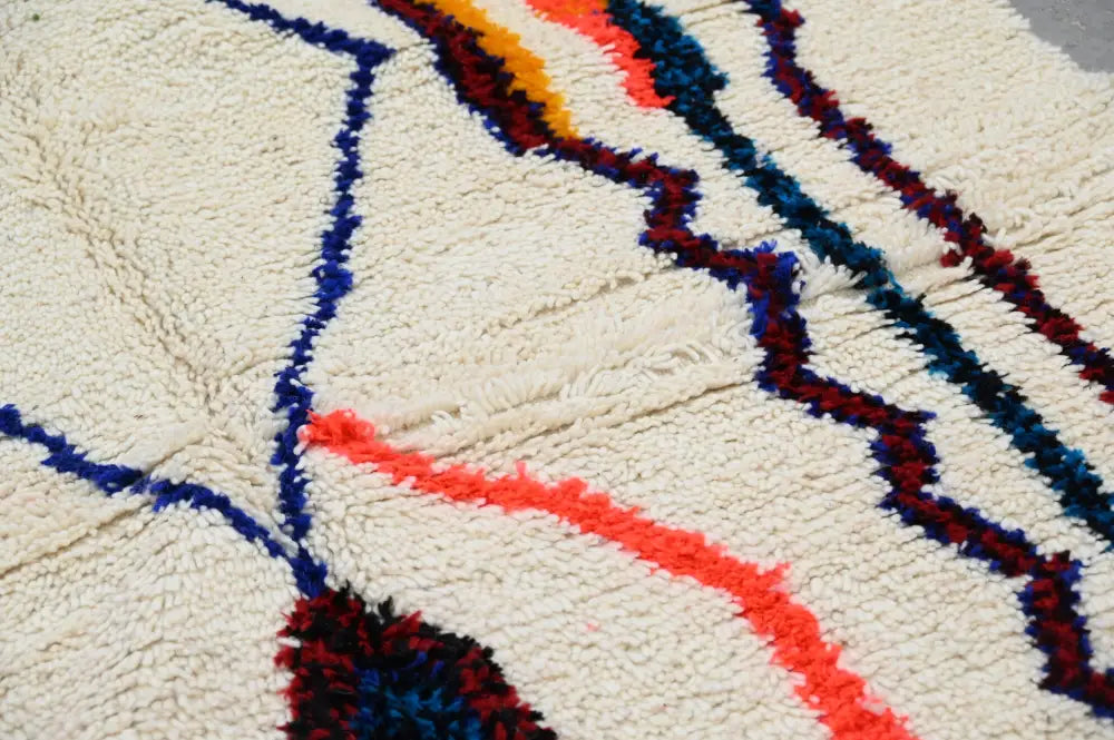 Handmade traditional azilal rug beige and orange bedroom decor