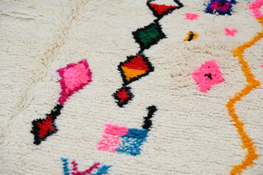 Handmade beige moroccan azilal rug with colorful patterns living room