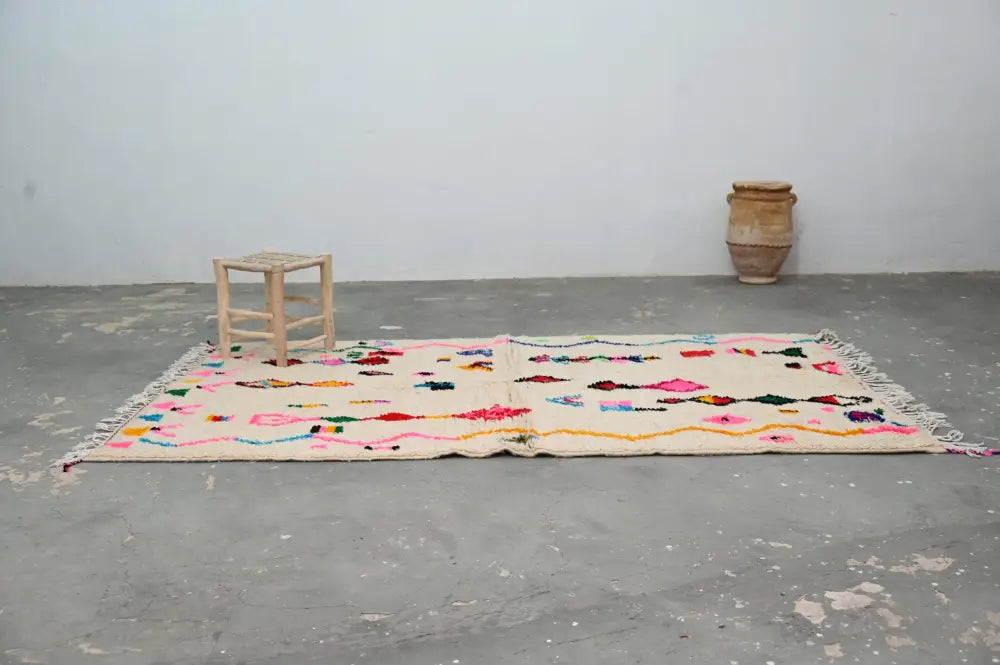 Handmade beige moroccan azilal rug with colorful patterns living room