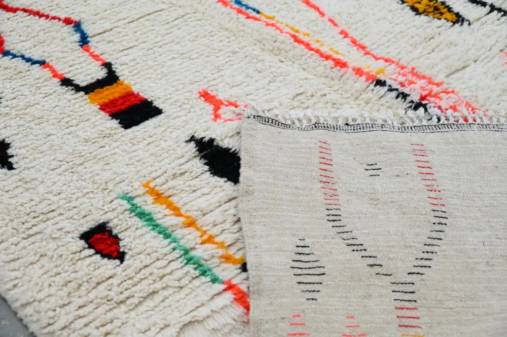 Handmade beige geometric moroccan azilal rug bedroom decor
