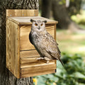 Rustic light brown wooden screech owl house outdoor nesting box