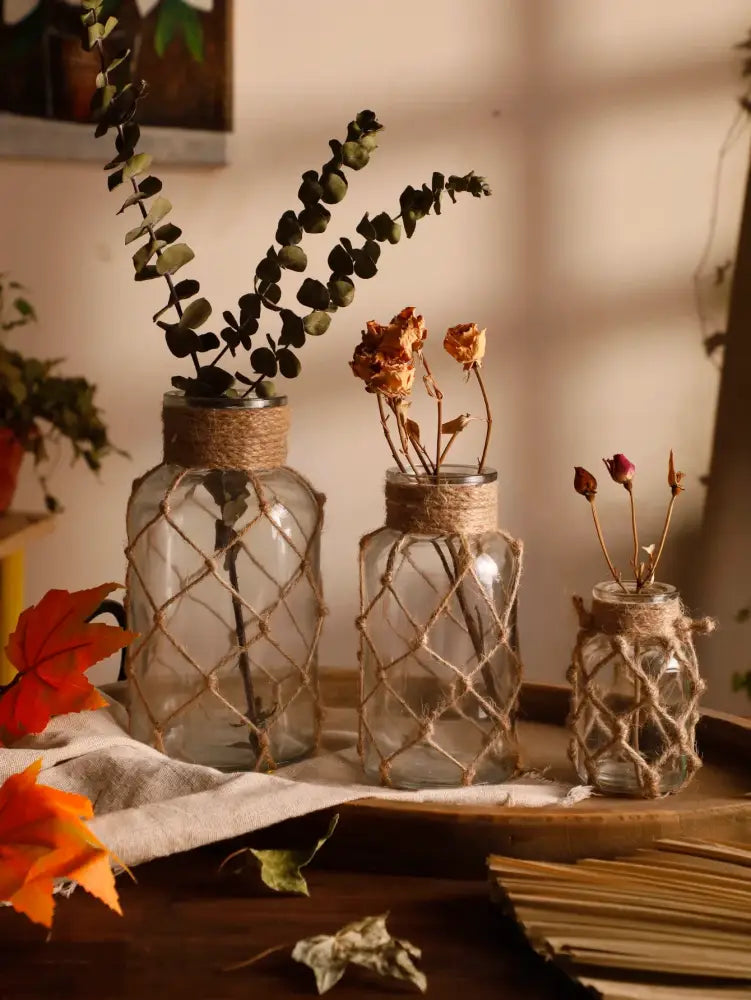 Rustic hanging glass vase with hemp rope twine netting – living room