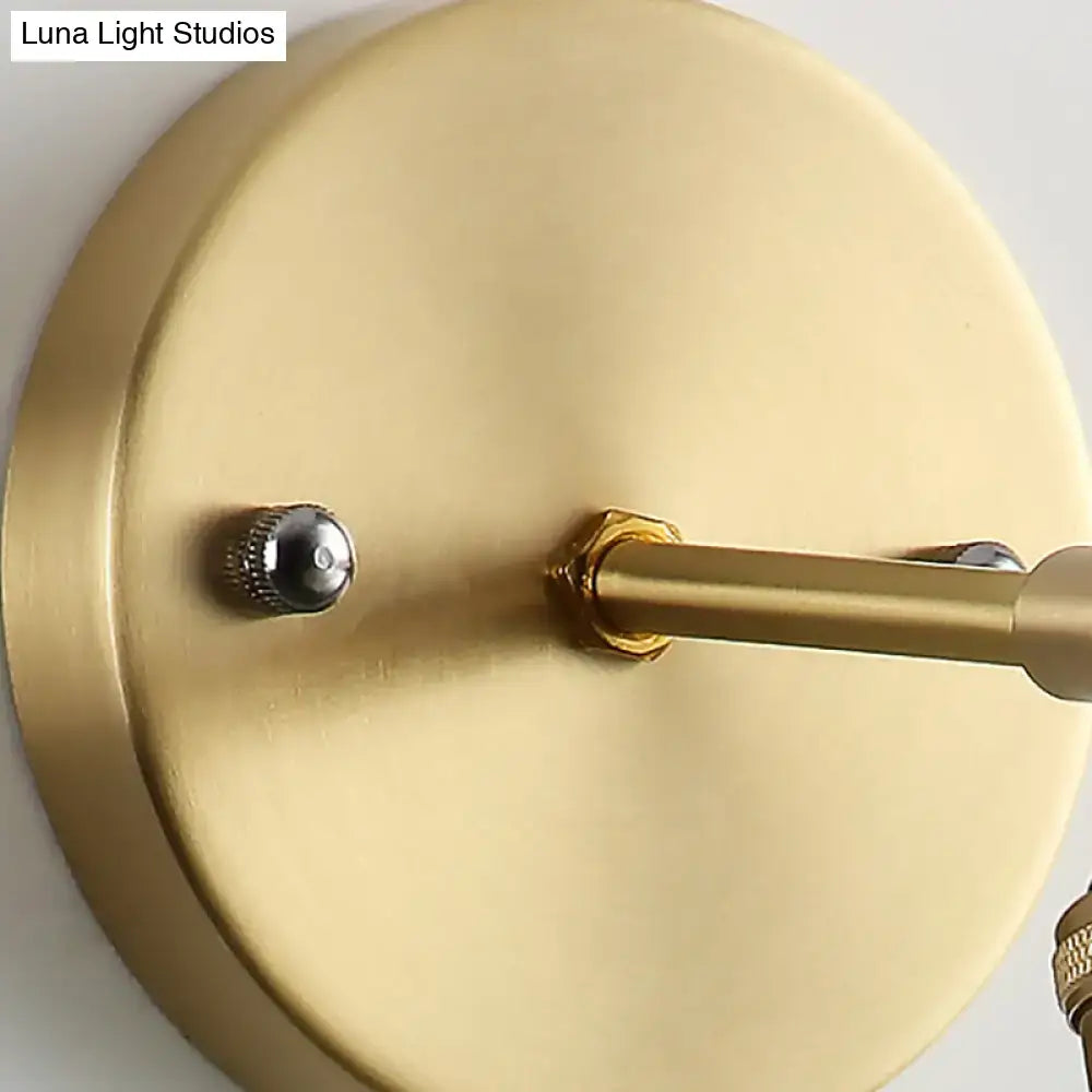 Industrial brass sconce with textured glass dome – bedroom light