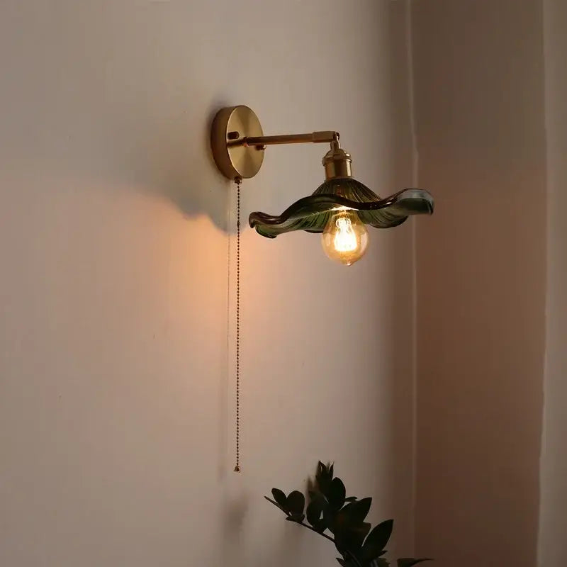 Green ribbed glass wall sconce with pull chain switch for bedroom