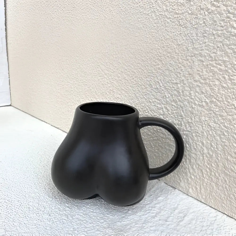 Playful white speckled butt shape ceramic coffee cup kitchen decor