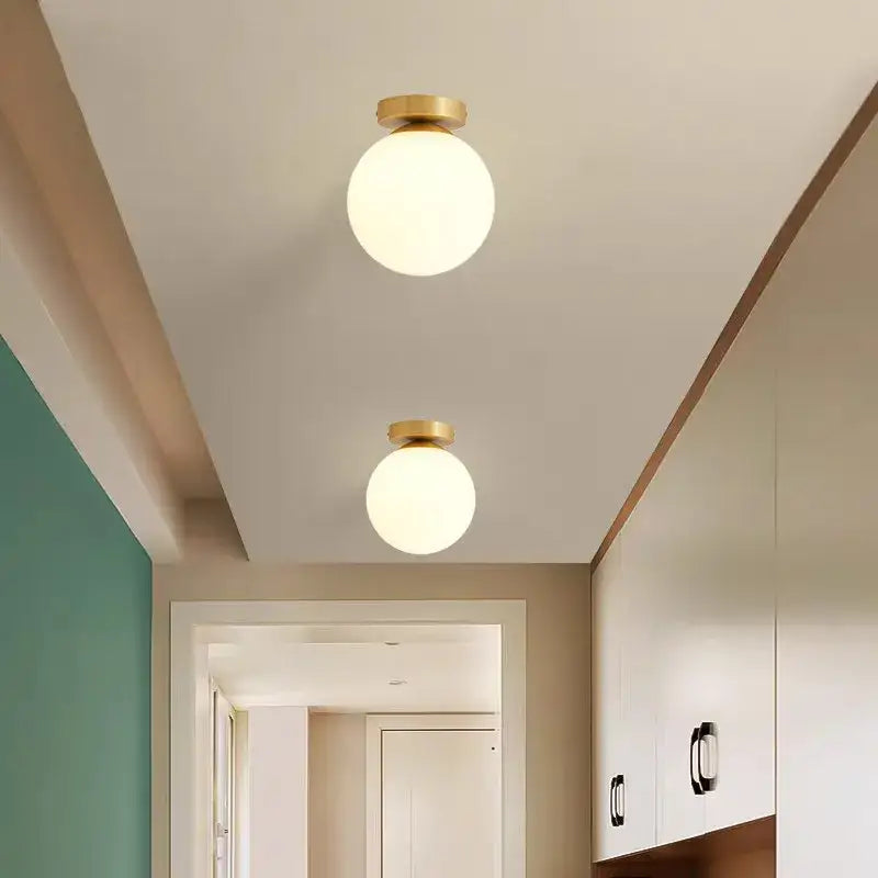 Modern brass ball ceiling light for living room with frosted glass