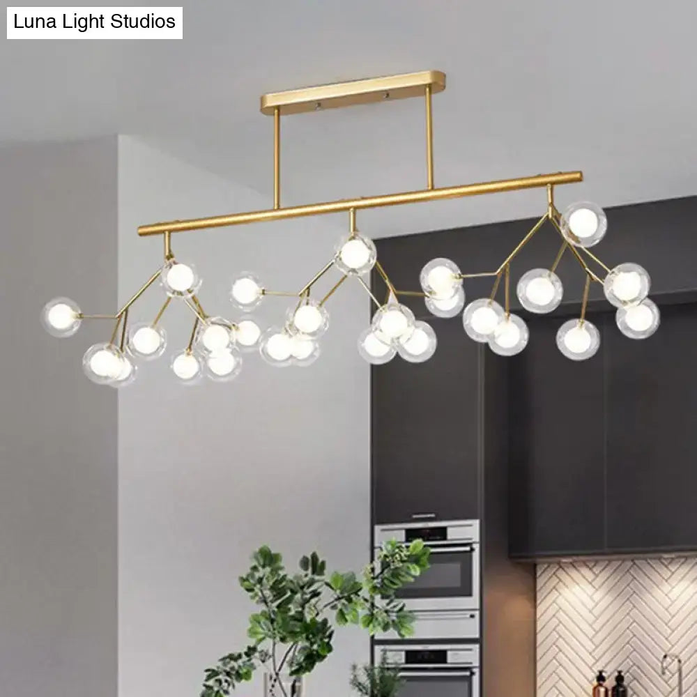 Modern gold firefly island pendant – dining room glass globe light