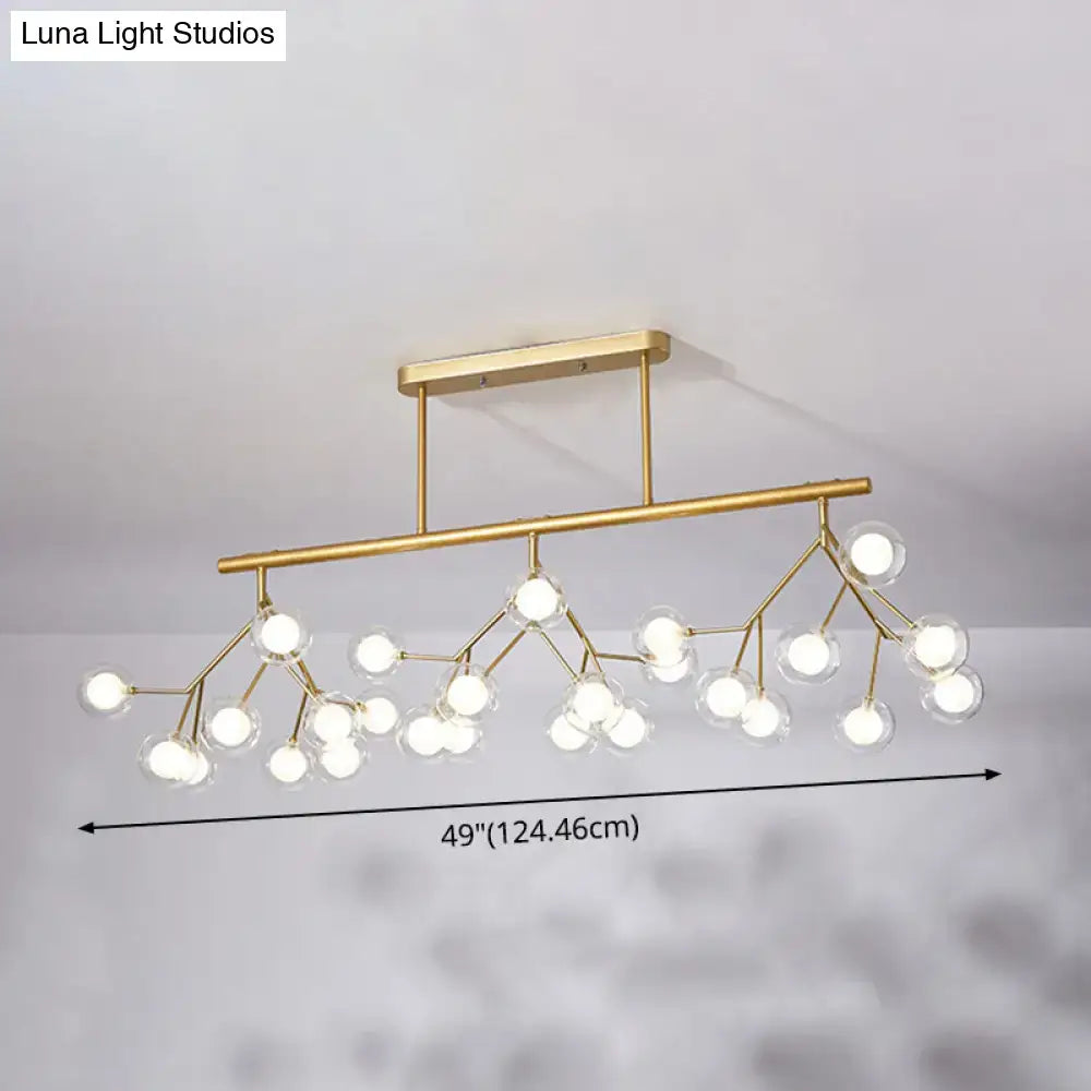 Modern gold firefly island pendant – dining room glass globe light