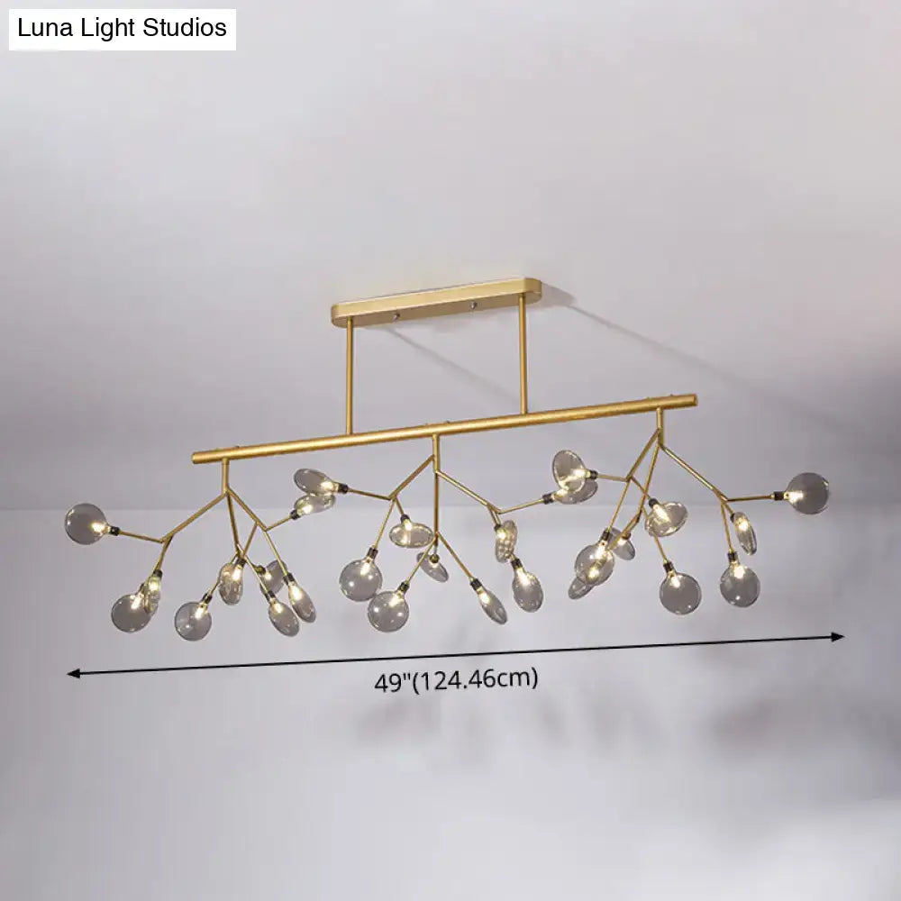 Modern gold firefly island pendant – dining room glass globe light