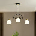 Modern black & brass arched pendant light with clear white glass kitchen