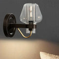 Modern black & brass wall sconce with glass mushroom shade bedroom