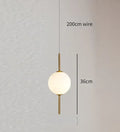 Modern gold glass pendant lighting – dining room spherical bulbs