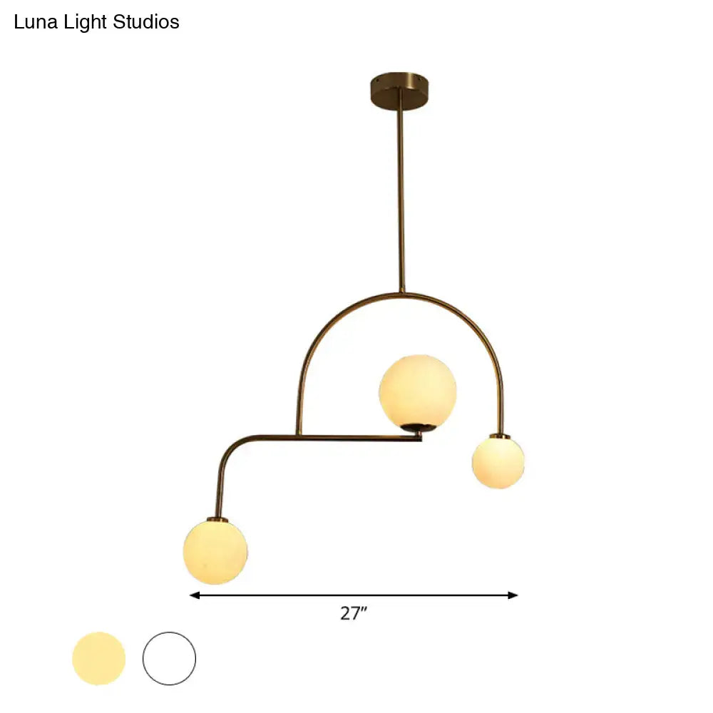 Modern gold global bedroom pendant light with white frosted glass