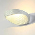 Modern minimalistic wall sconces – living room curved ridged lighting