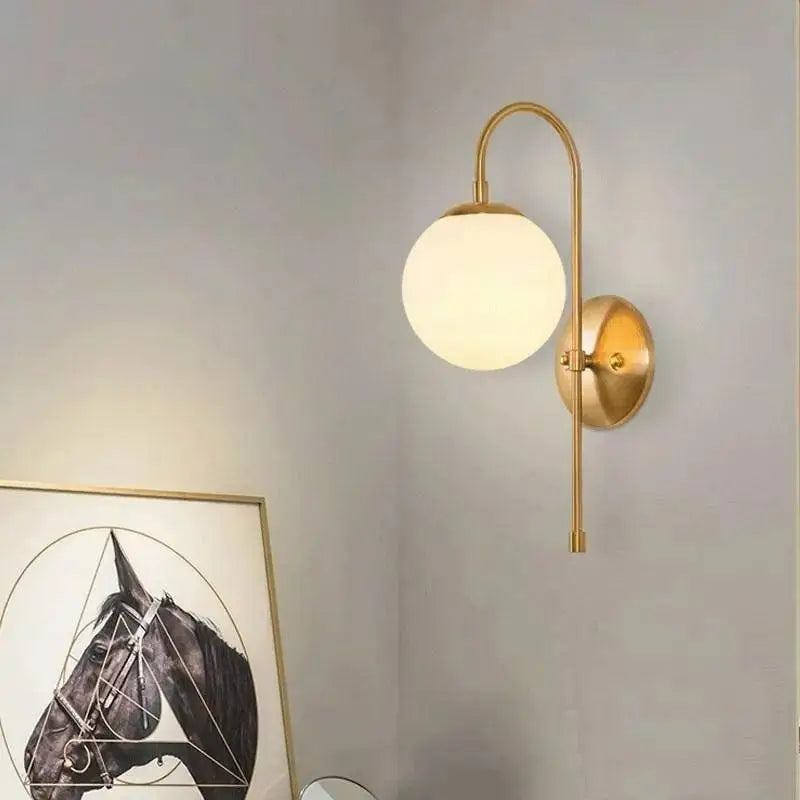 Modern gold wall lamp bedroom frosted globe sconce