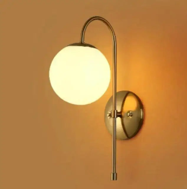 Modern gold wall lamp bedroom frosted globe sconce