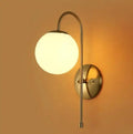 Modern gold wall lamp bedroom frosted globe sconce