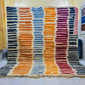 Vibrant striped moroccan handmade beni ouarain rug bedroom decor