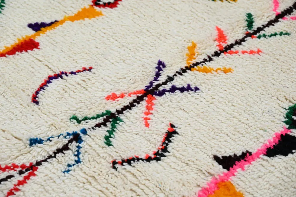 Beige moroccan handmade azilal rug with geometric patterns living room