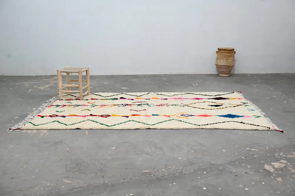 Beige moroccan handmade azilal rug with geometric patterns living room