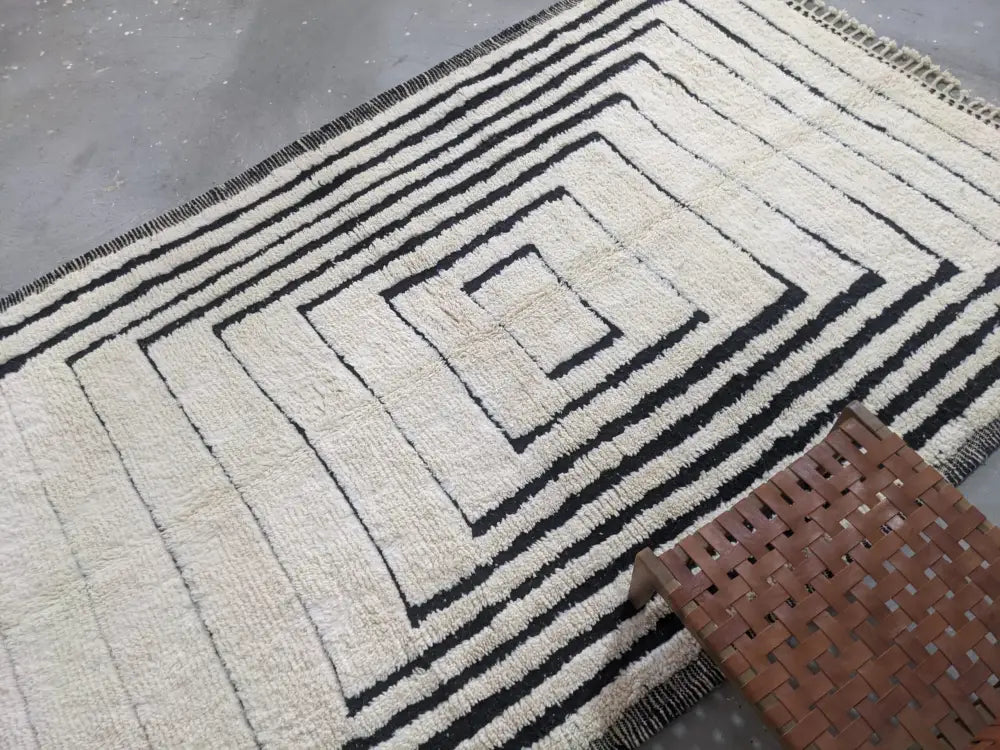Handmade cream and black beni ouarain rug living room decor