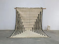 Handmade cream and black beni ouarain rug living room decor