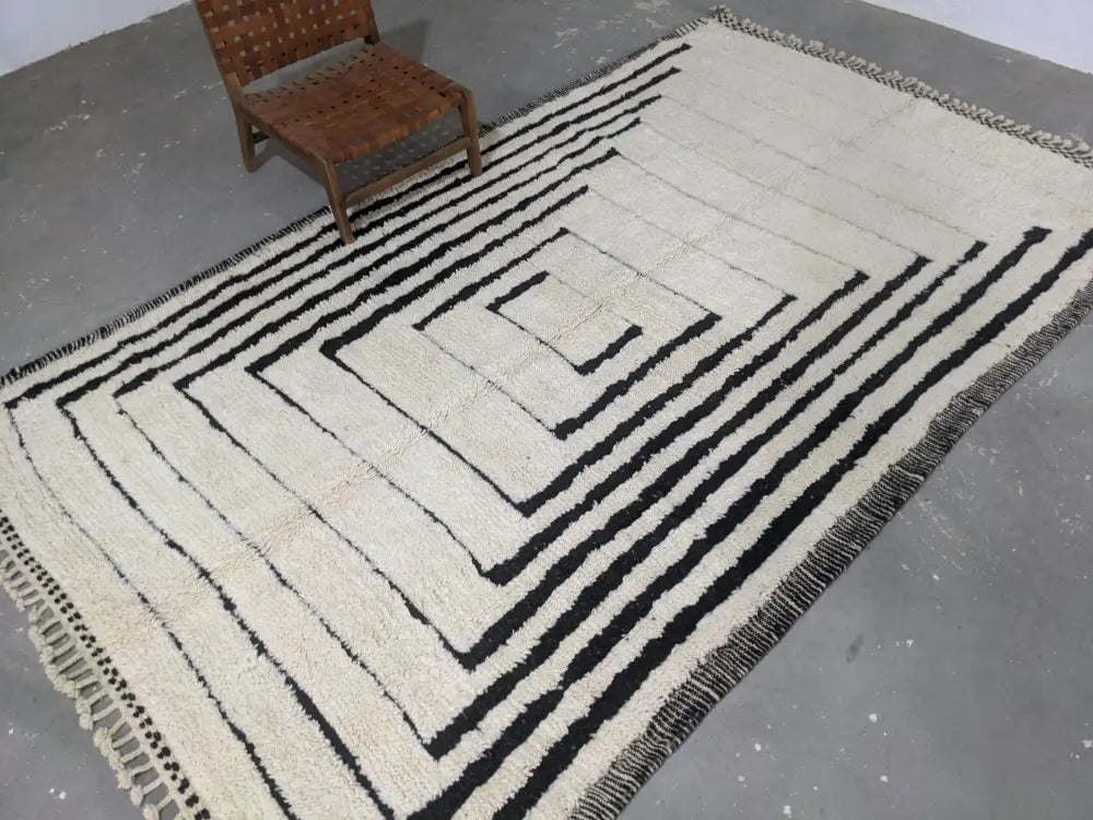 Handmade cream and black beni ouarain rug living room decor