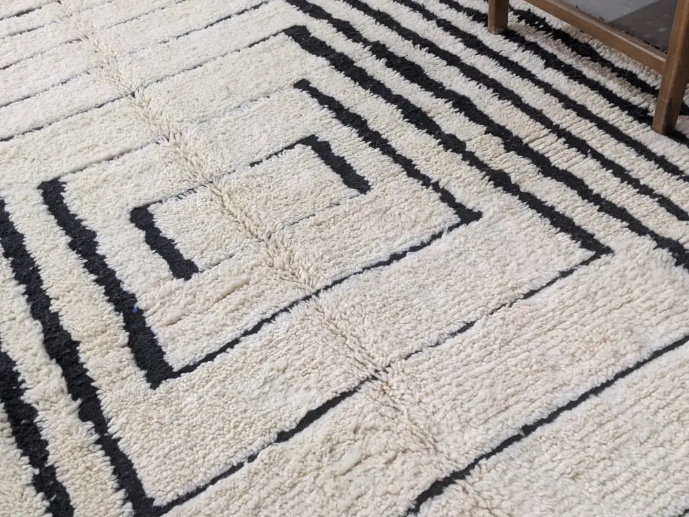 Handmade cream and black beni ouarain rug living room decor