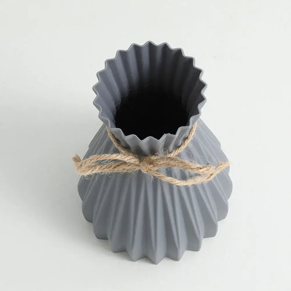 Origami style pink blue and white plastic flower vase living room