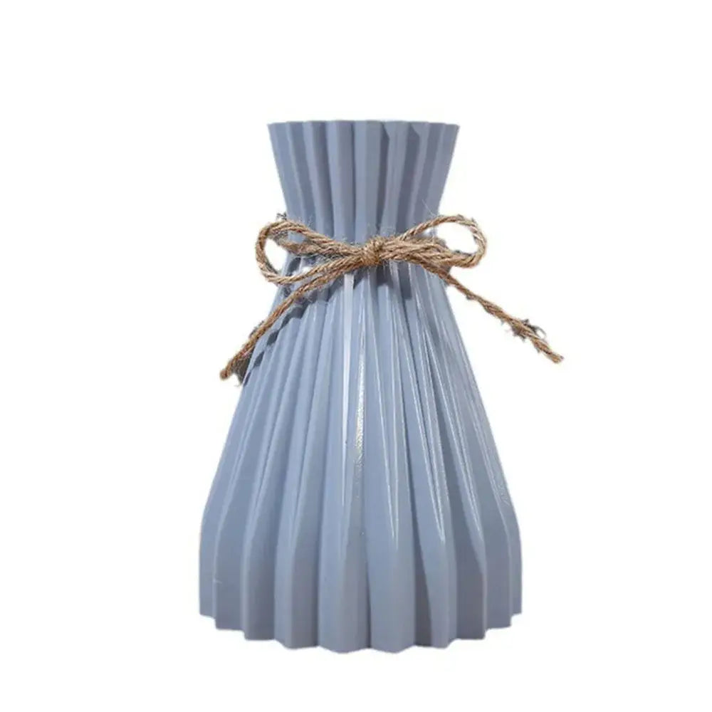 Origami style pink blue and white plastic flower vase living room