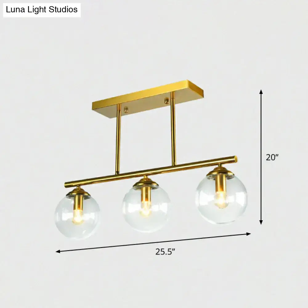 Postmodern gold kitchen island light with globe glass shade