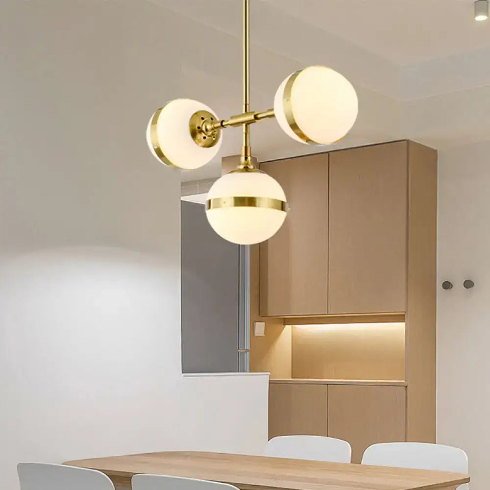 Postmodern gold branch pendant light with white ball glass dining room