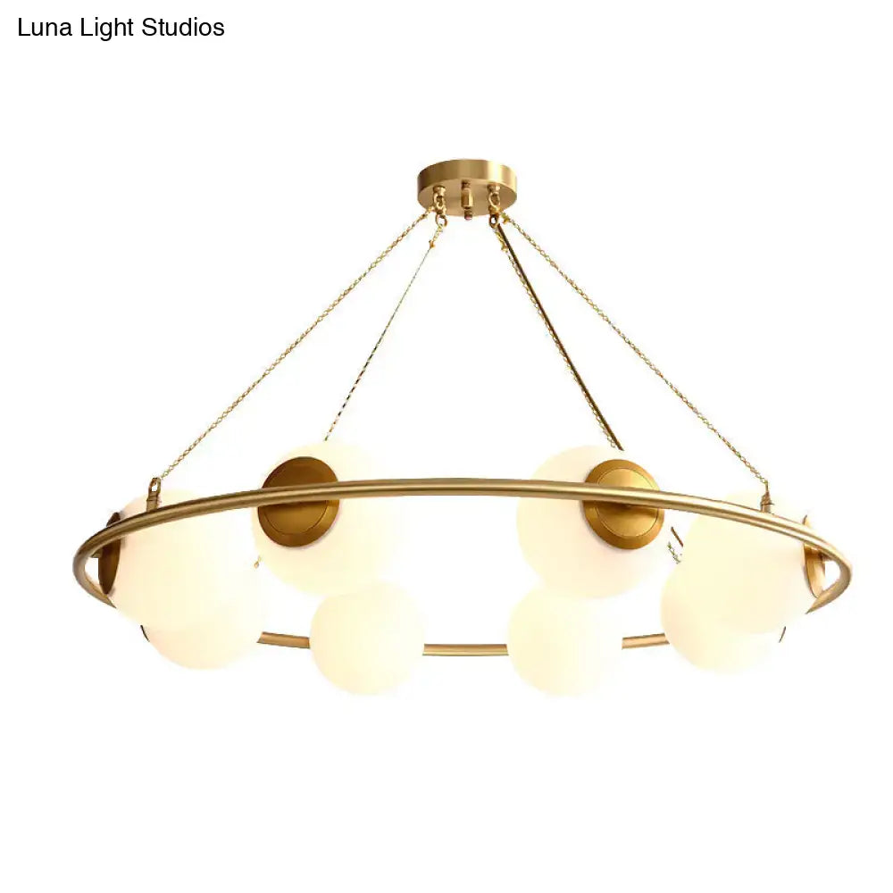 Postmodern brass circular chandelier with frosted glass dining room