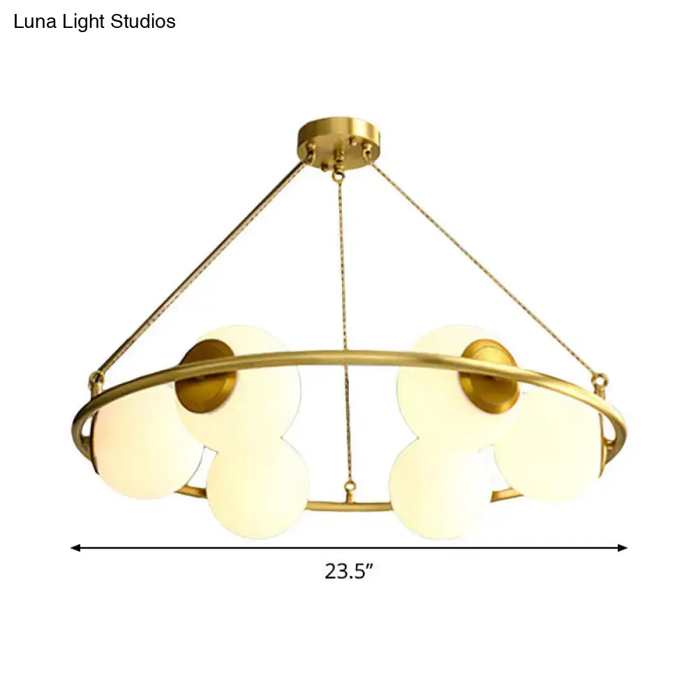 Postmodern brass circular chandelier with frosted glass dining room
