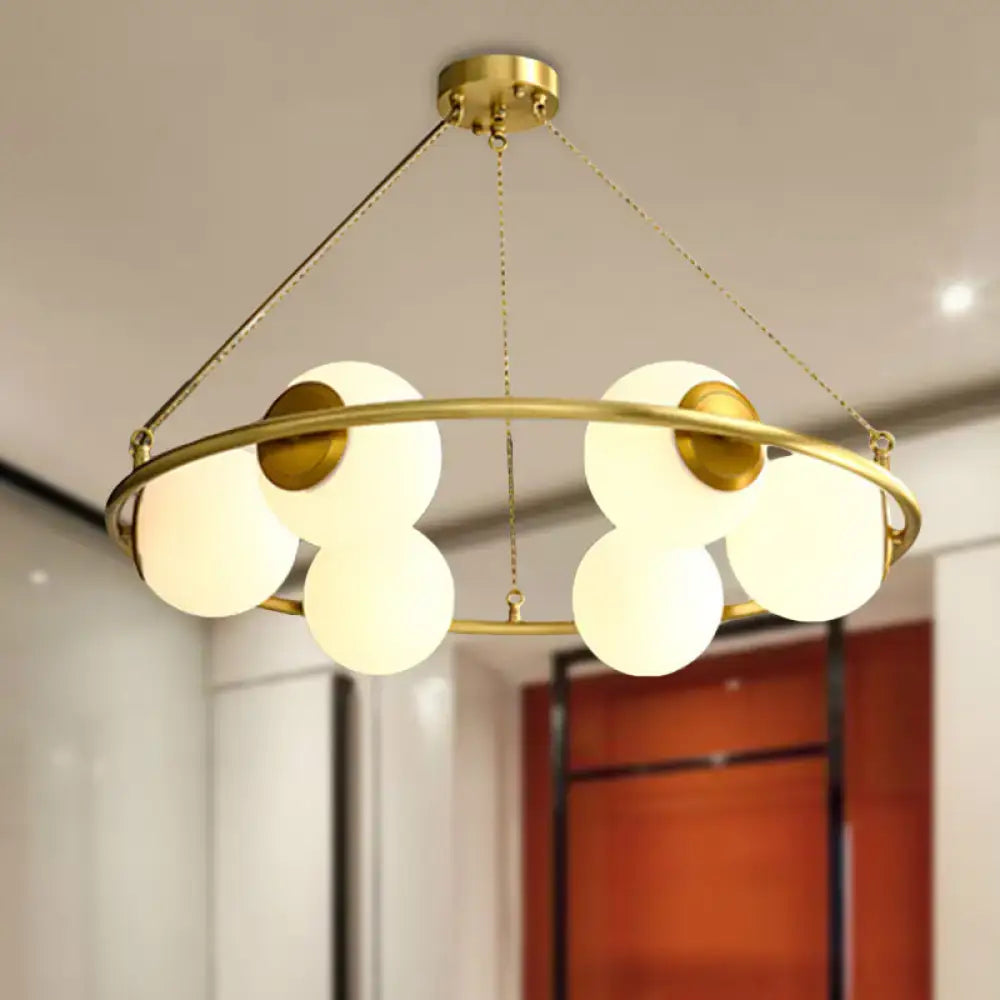 Postmodern brass circular chandelier with frosted glass dining room