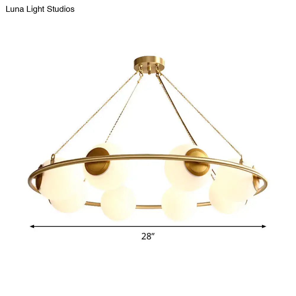 Postmodern brass circular chandelier with frosted glass dining room