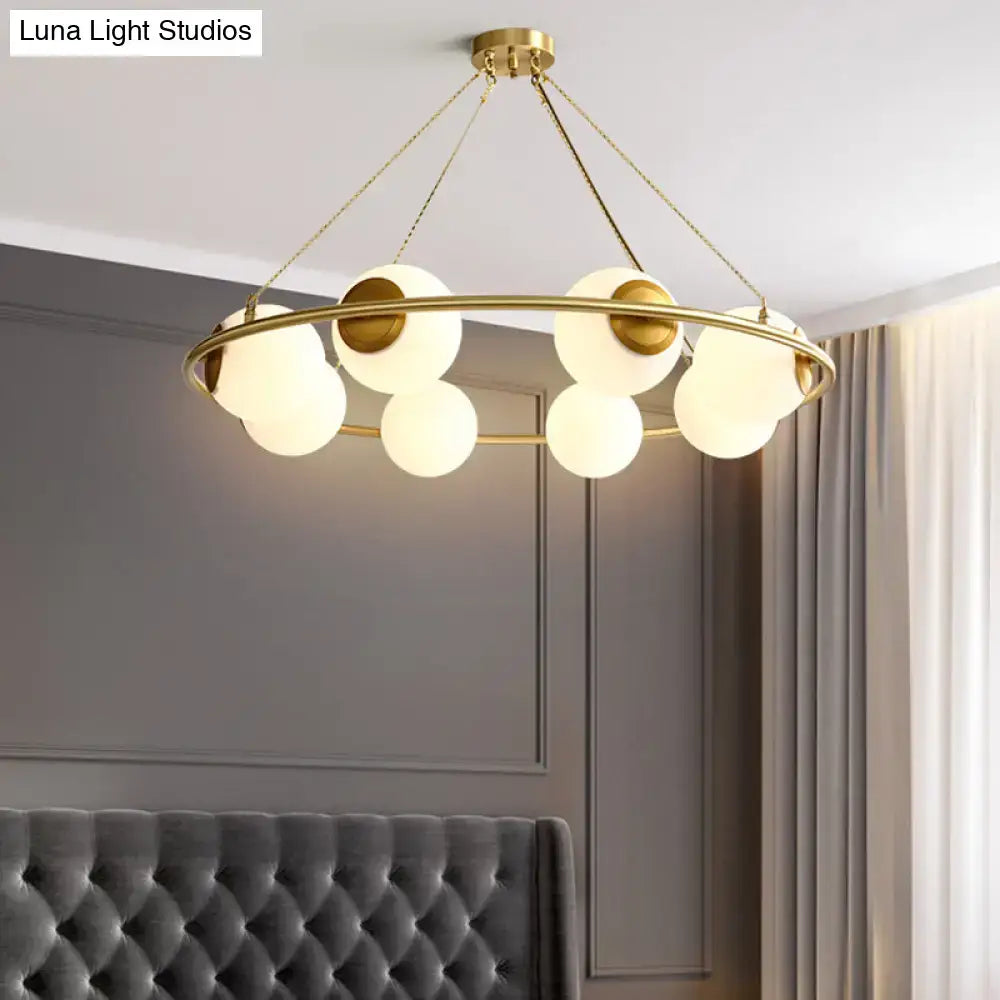 Postmodern brass circular chandelier with frosted glass dining room