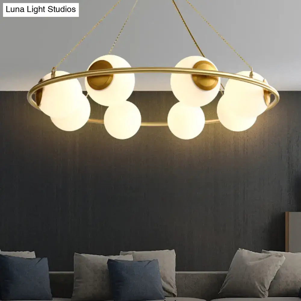 Postmodern brass circular chandelier with frosted glass dining room