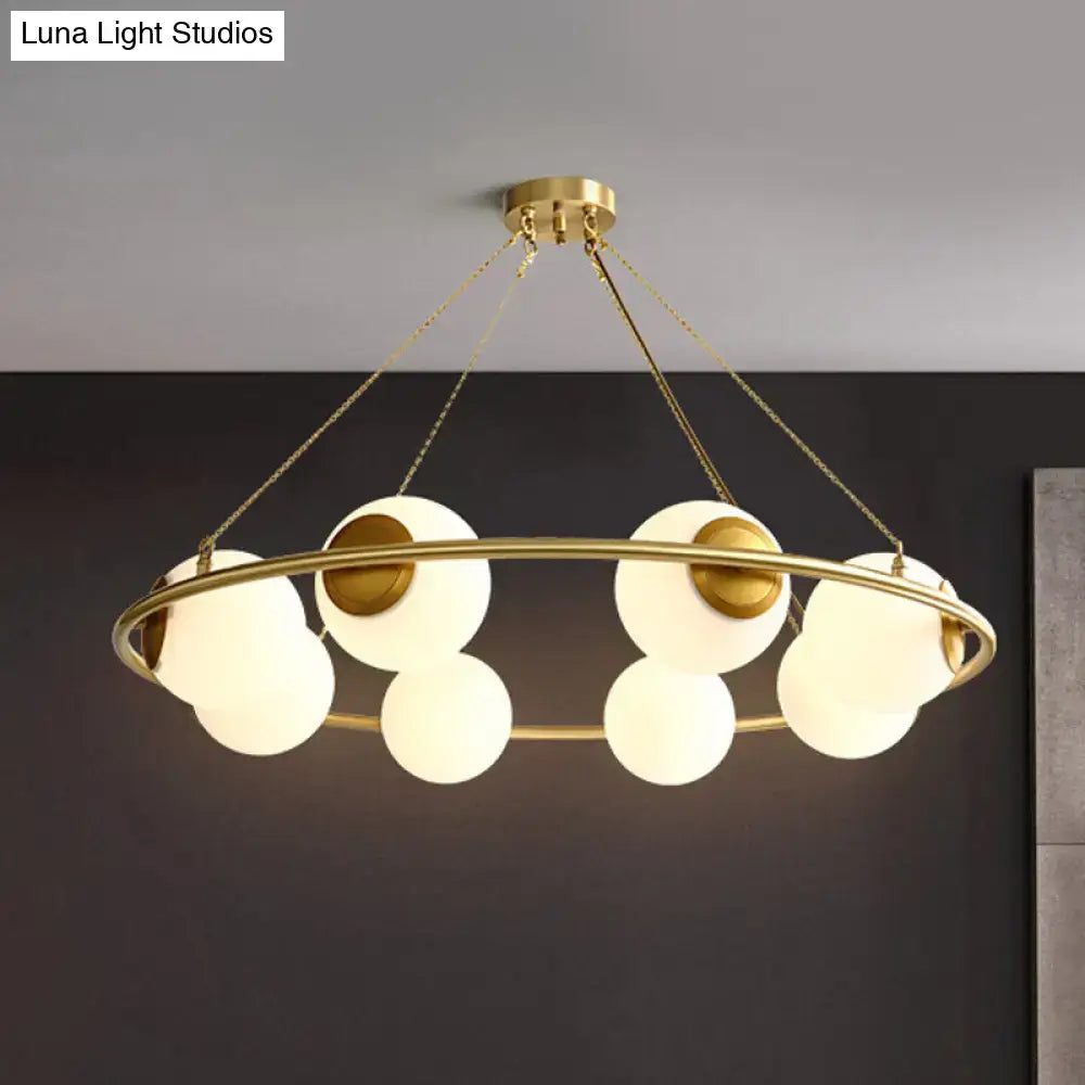 Postmodern brass circular chandelier with frosted glass dining room