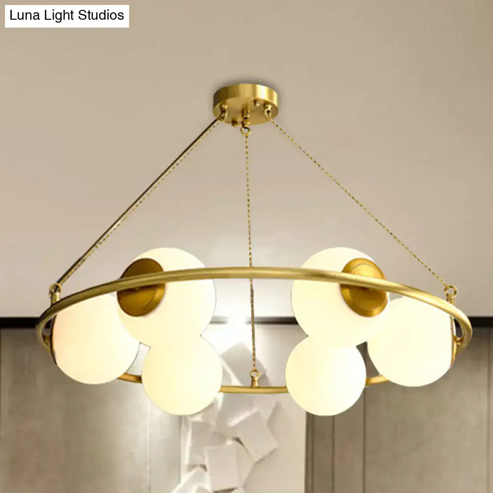 Postmodern brass circular chandelier with frosted glass dining room