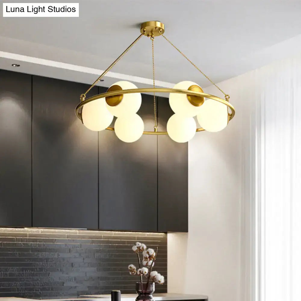 Postmodern brass circular chandelier with frosted glass dining room