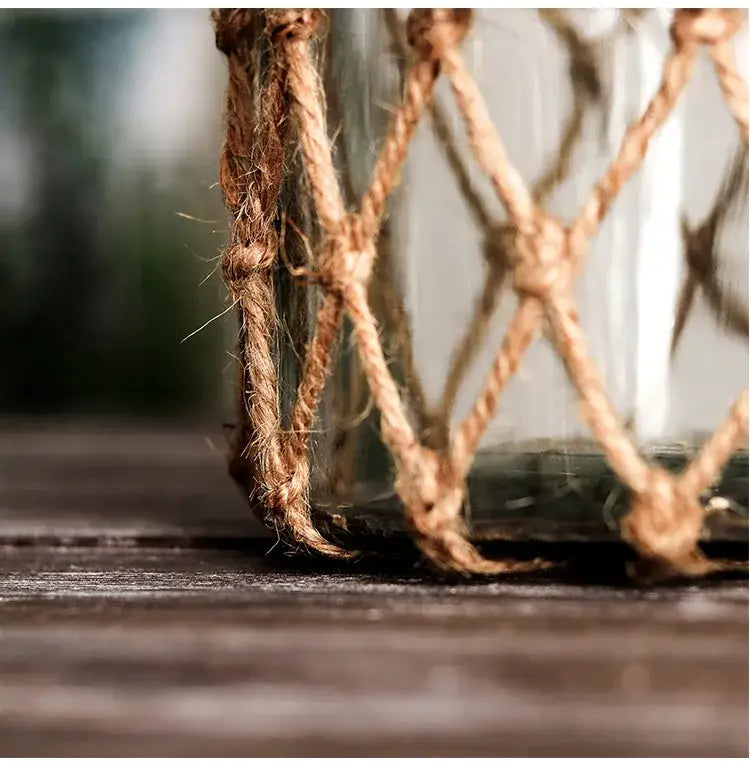 Rustic hanging glass vase with twine and metal handle – living room