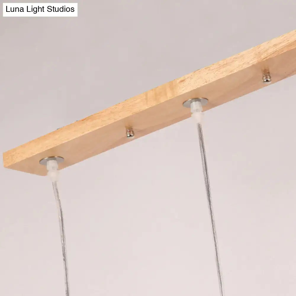 Minimalist wood island pendant light with opaline glass dining room