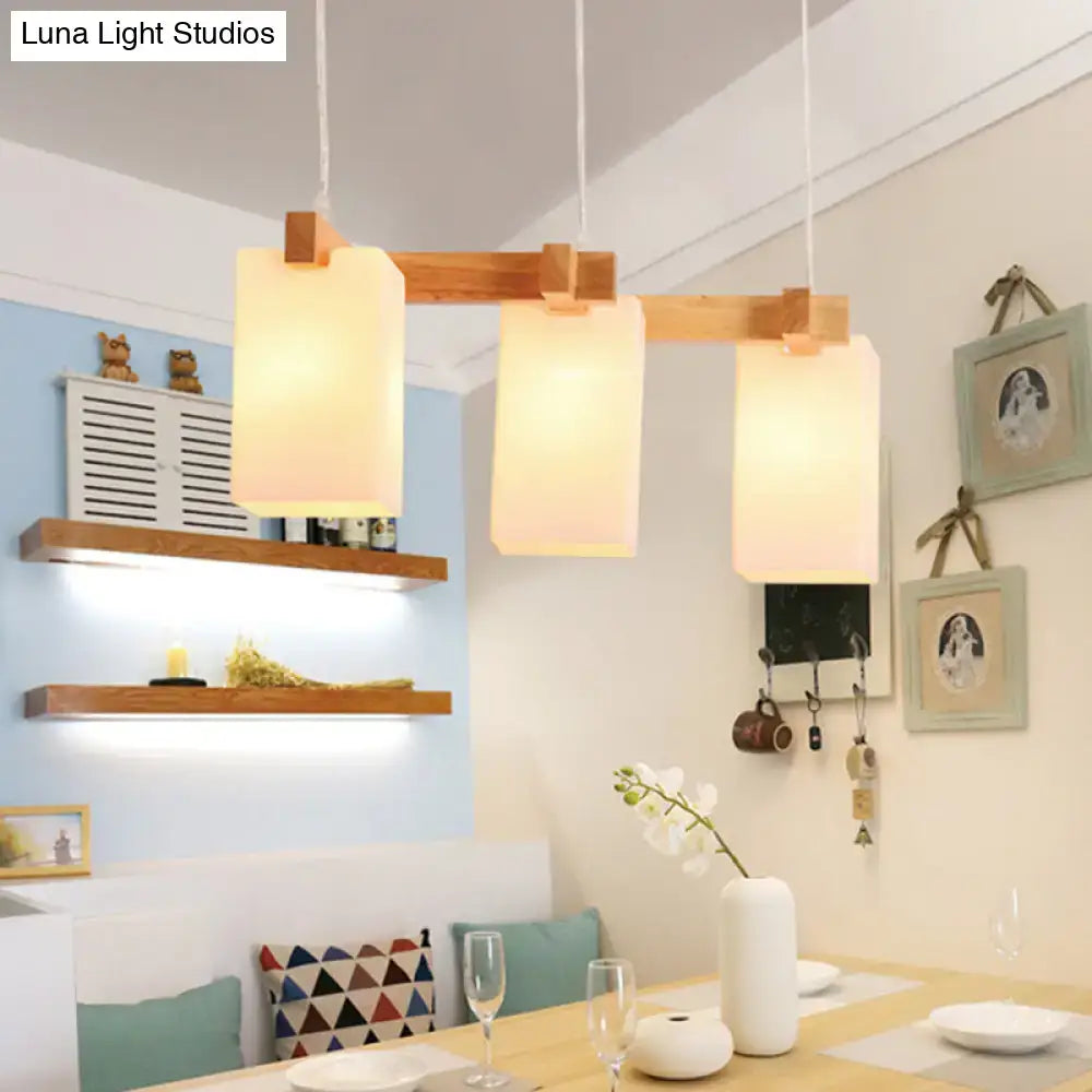 Minimalist wood island pendant light with opaline glass dining room