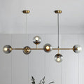 Modern brass and smoke grey glass pendant light dining room