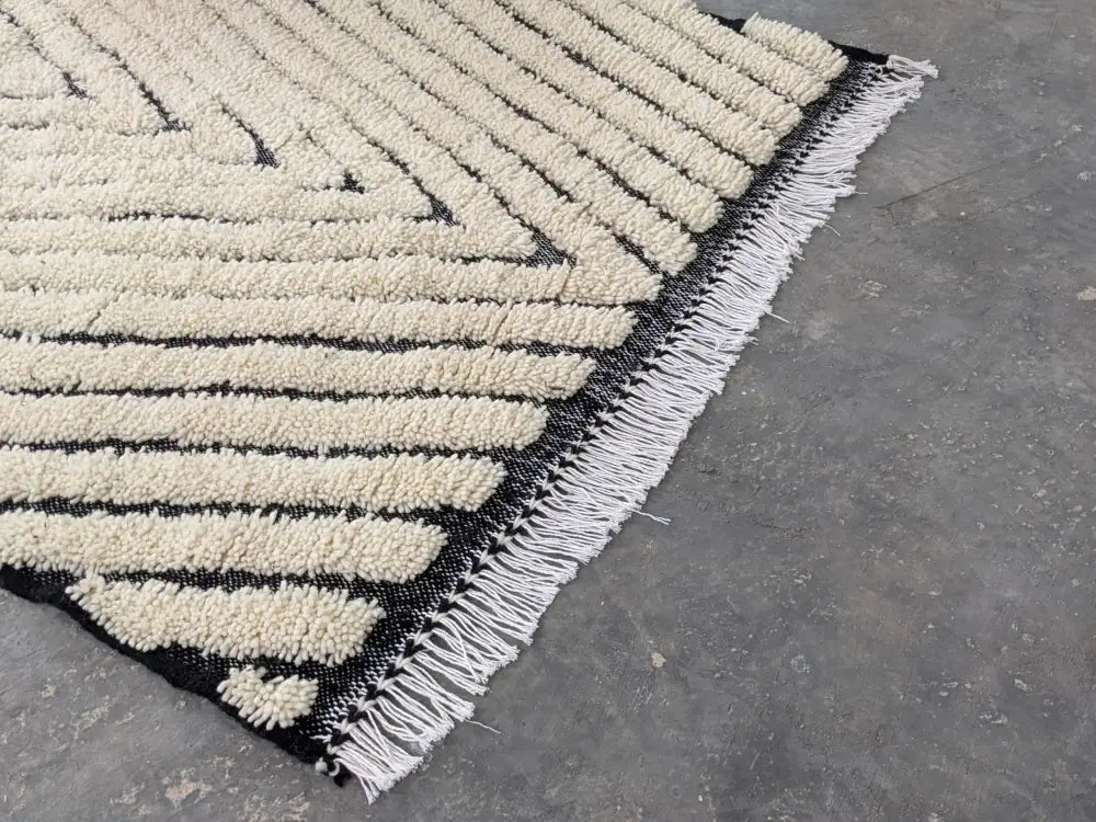 Traditional beni ouarain cream & black wool rug living room